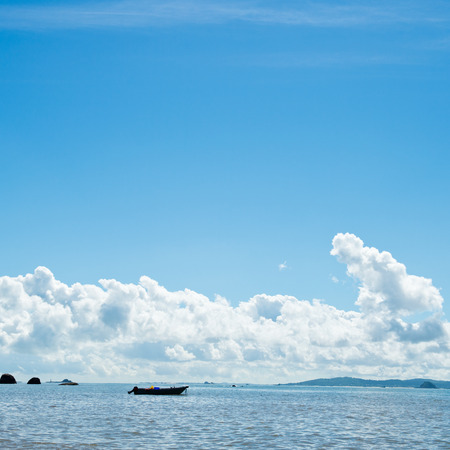 Blue sea with white clouds for background.の写真素材
