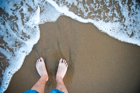 People standing on the beach.の写真素材