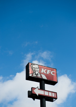 FUJIAN, CHINA - JULY 26: KFC's logo on blue sky  on July. 26, 2013 in Fujian, China. Kentucky Fried Chicken Restaurant is the world's largest chain of hamburger and chicken fast food restaurants.のeditorial素材