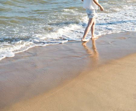 People walking on the beach.の写真素材
