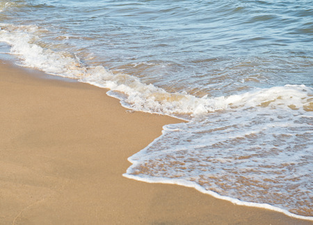 wave of the sea on the sandy beachの写真素材