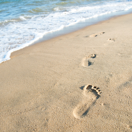 Footprints on the sand beachの写真素材