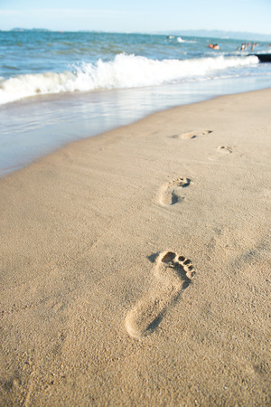Footprints on the sand beachの写真素材