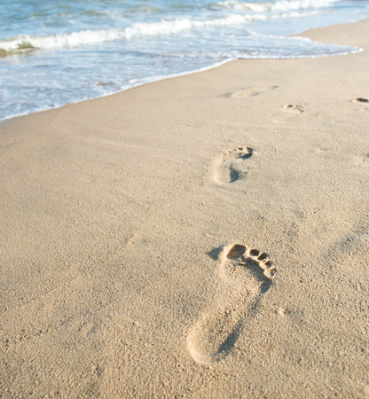 Footprints on the sand beachの写真素材