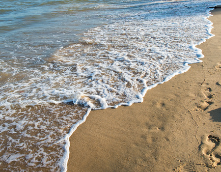 wave of the sea on the sandy beachの写真素材