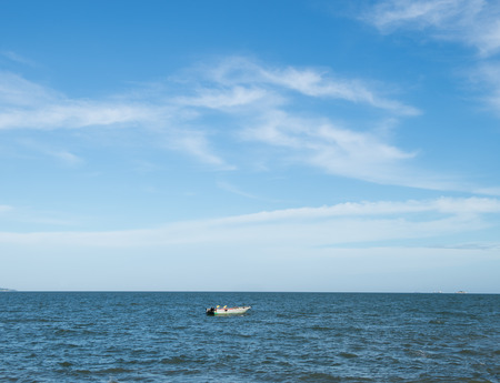 Blue sea with white clouds for background.の写真素材