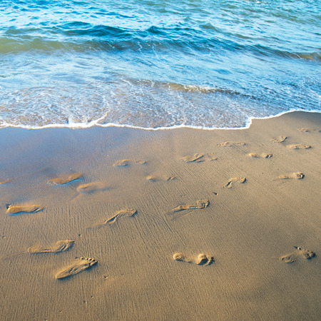 Footprints on the sand beachの写真素材