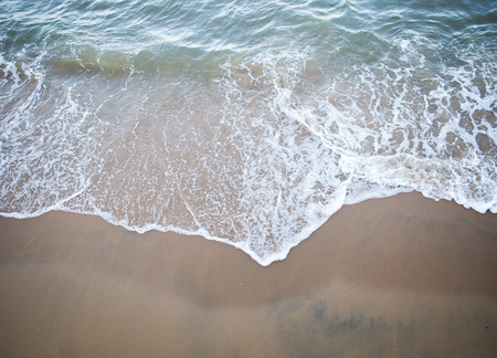 wave of the sea on the sandy beachの写真素材