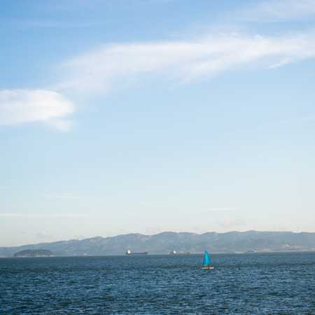 Blue sea with white clouds for background.の写真素材