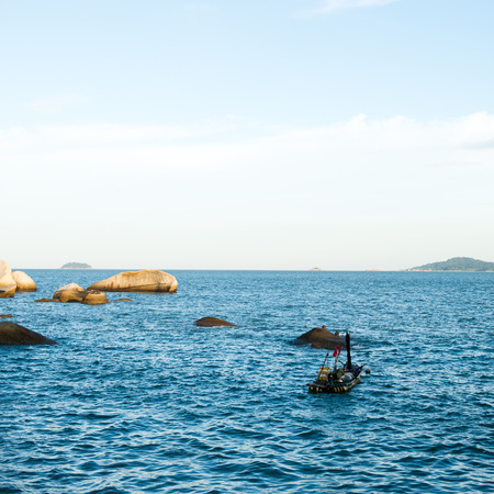 Blue sea with white clouds for background.の写真素材