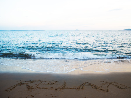Hand drawn of "RELAX"  on the beachの写真素材
