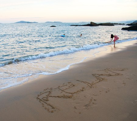 Hand drawn of "RELAX"  on the beachの写真素材