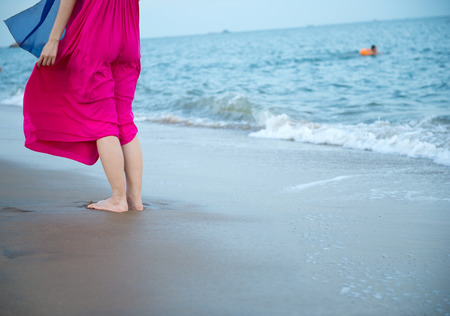 People standing on the beach.の写真素材
