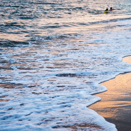 wave of the sea on the sandy beachの写真素材