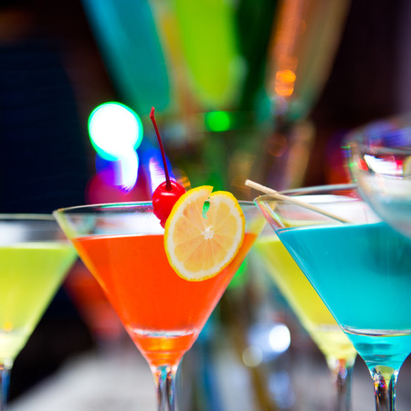 Group of colorful cocktail in martini glasses.の写真素材