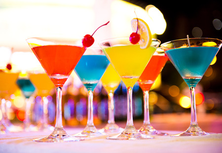 Group of colorful cocktail in martini glasses.の写真素材