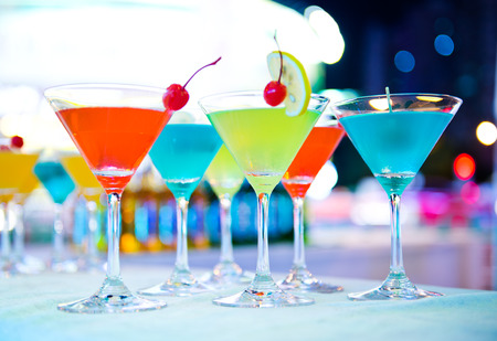 Group of colorful cocktail in martini glasses.の写真素材
