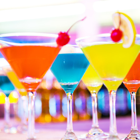 Group of colorful cocktail in martini glasses.の写真素材