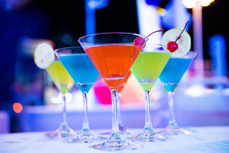 Group of colorful cocktail in martini glasses.の写真素材