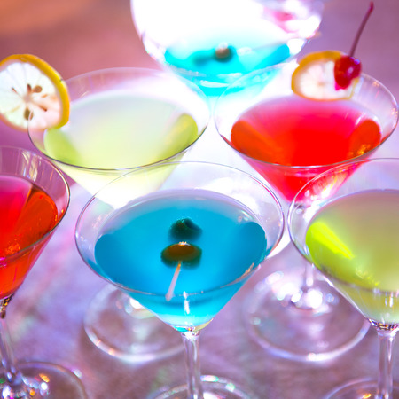 Group of colorful cocktail in martini glasses.の写真素材