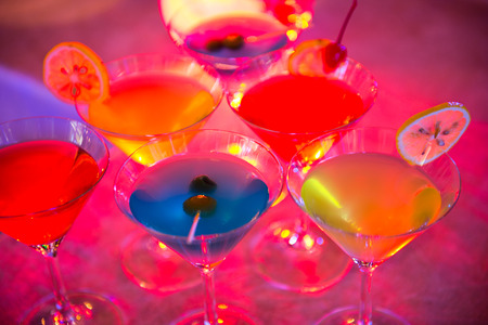 Group of colorful cocktail in martini glasses.の写真素材