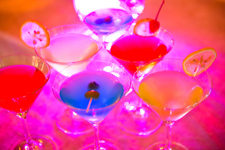 Group of colorful cocktail in martini glasses.の写真素材