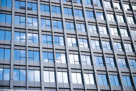 modern glass silhouettes on modern building.の写真素材