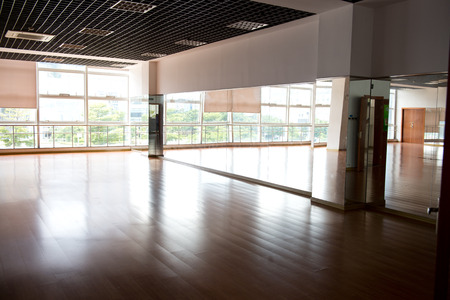 Empty dancing room with hardwood floor and mirror.のeditorial素材