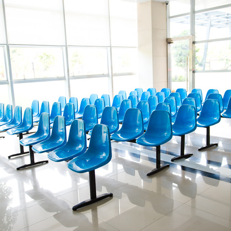 Hospital waiting room with empty chairs.の写真素材