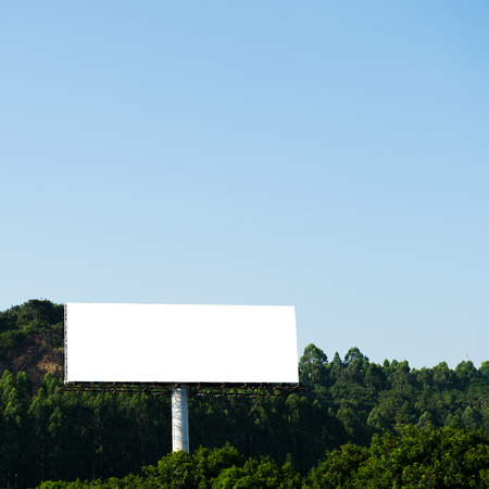 Blank billboard against blue sky.の写真素材