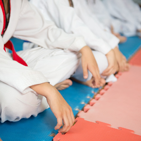 Group of taekwondo trainer sitting on floor for a rest.の写真素材