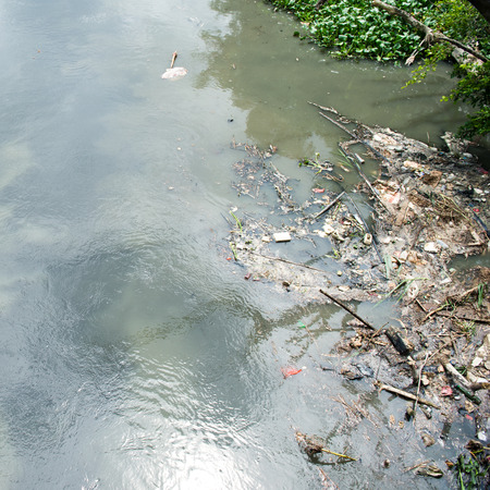Water pollution in river with trash.の写真素材