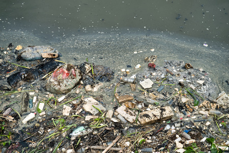 Water pollution in river with trash.の写真素材