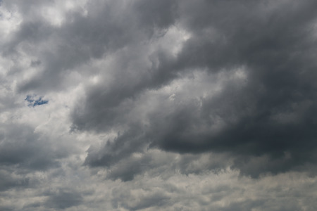 Background of dark clouds before a thunder-stormの写真素材