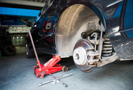 Car without tire need to be repaired.の写真素材
