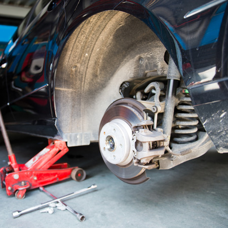 Car without tire need to be repaired.の写真素材