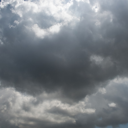 Background of dark clouds before a thunder-stormの写真素材