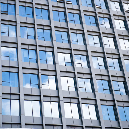 modern glass silhouettes on modern building.の写真素材