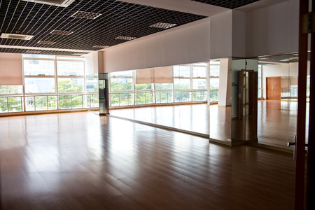 Empty dancing room with hardwood floor and mirror.のeditorial素材