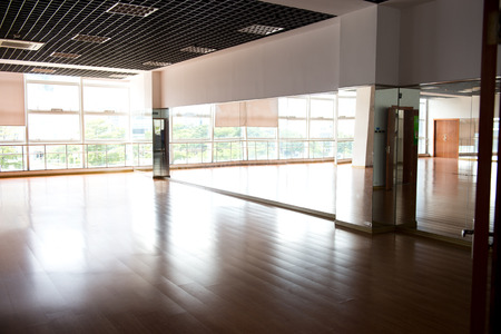 Empty dancing room with hardwood floor and mirror.のeditorial素材