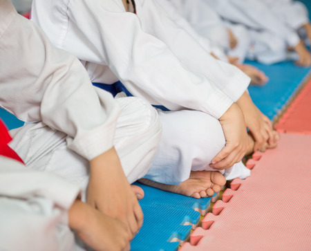Group of taekwondo trainer sitting on floor for a rest.の写真素材
