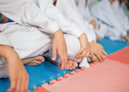 Group of taekwondo trainer sitting on floor for a rest.の写真素材