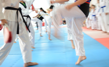 People in martial arts training exercising Taekwondo. blur motionの写真素材