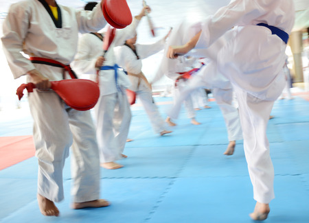 People in martial arts training exercising Taekwondo. blur motionの写真素材