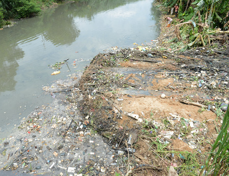 Water pollution in river with trash.の写真素材