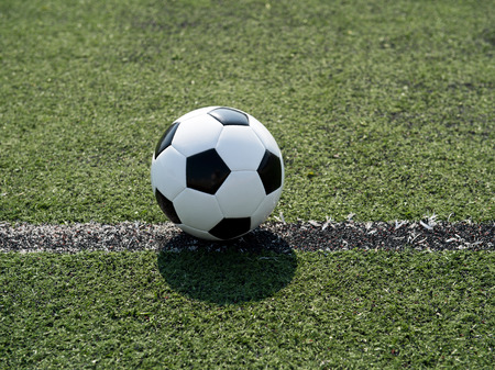 soccer ball on stadium grass line.の写真素材