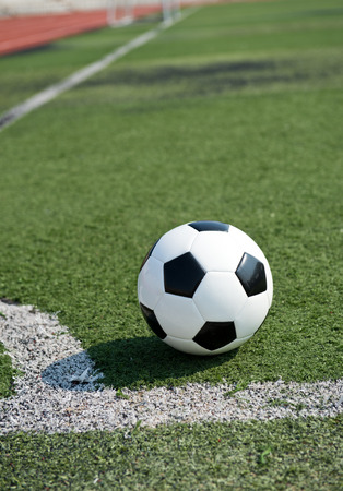 soccer ball on stadium grass line.の写真素材