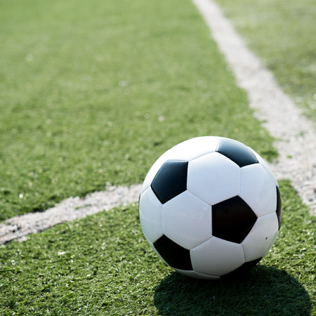 soccer ball on stadium grass line.の写真素材