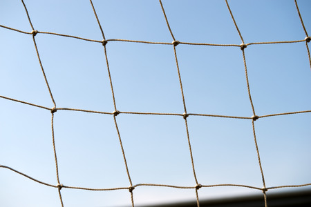 Closeup of white soccer goal net.の写真素材