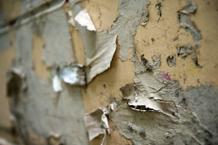 old torn posters on grunge wallの写真素材
